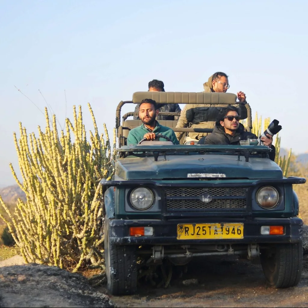 Guests sitting in a safari jeep in Jawai